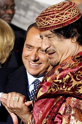 Italian PM Silvio Berlusconi and Libyan leader Muammar Gaddafi.