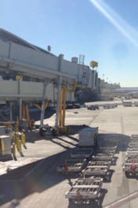 "It's like a ghost town": Virgin Australia passenger Alexander Reid took this photo from the VA1 Boeing 777-300ER, which is sitting on the tarmac with 361 passengers on board.