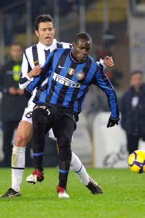 Fabio Grosso of Juventus competes with Mario Balotelli of Inter in 2009.