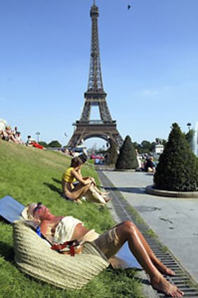 To keep costs down, consider skipping going up the Eiffel Tower and relax on the lawns instead.