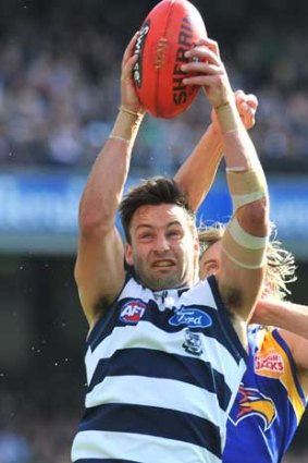 Geelong's Jimmy Bartel marks in front of West Coast's Mark Nicoski in their preliminary final at the MCG.