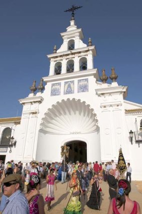 Pilgrims visit El Rocio?s shrine each year.
