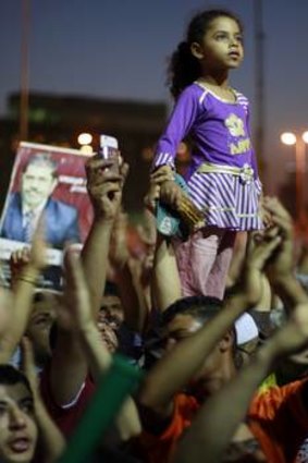 A child stands tall at a Cairo rally.
