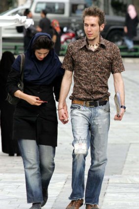An Iranian couple walk through Mellat Park in the capital Tehran.
