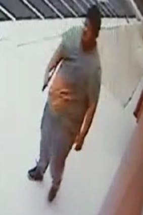 A CCTV image of a man who allegedly carried a machete into an Islamic school.