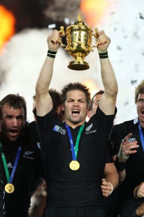 Reigning champions: Richie McCaw holds the trophy aloft in 2011.