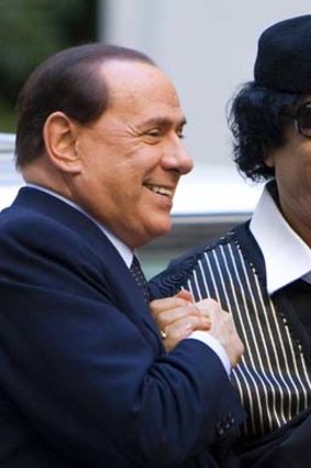 Muammar Gaddafi with Silvio Berlusconi.