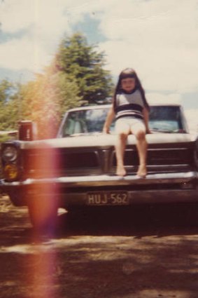 A young Rehe on the family Pontiac.