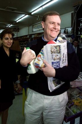 Peter Costello buys groceries on the first day of the GST in 2000.