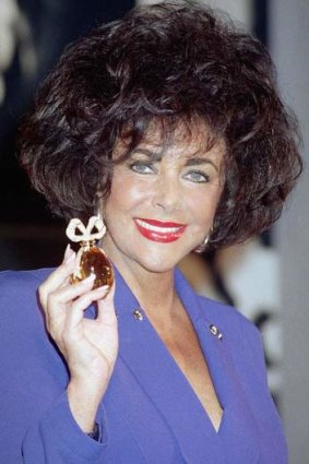 Actress Elizabeth Taylor with a $100,000 special edition of her White Diamonds fragrance in 1991.