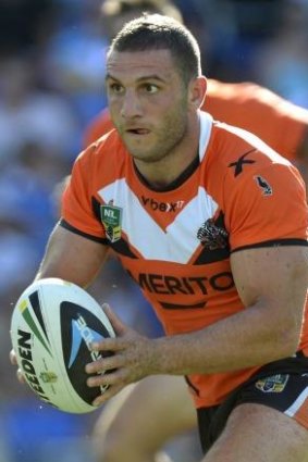 Robbie Farah in a Tigers jumpers dominated by Balmain orange.