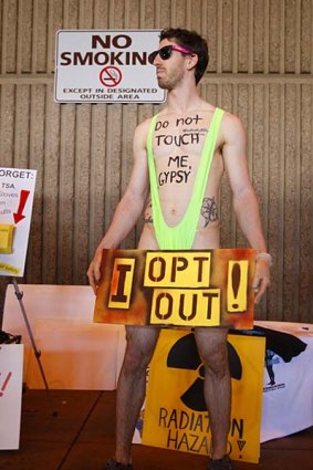 A man protests against the Transportation Security Administration's (TSA) screening procedures at the airport in Phoenix.