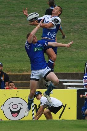 Brute force ... Newtown Jets and Canterbury Bulldogs players struggle for supremacy at Belmore Sportsground on Sunday.