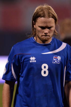 Iceland midfielder Birkir Bjarnason leaves the pitch.
