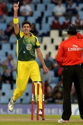 Breakthrough: Mitchell Starc successfully appeals for the wicket of dangerous South African batsman Hashim Amla.