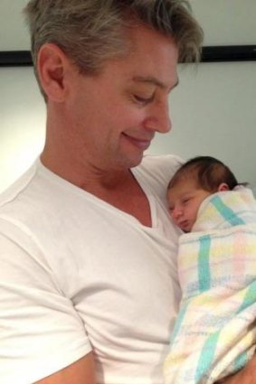 Snug: Luke Ricketson and his baby daughter Sophia Edie.