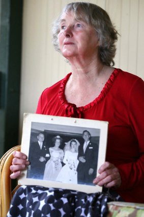 Elaine Postlethwaite, whose husband Len died in the fire, with a photo of her wedding.