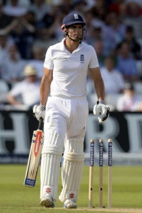 England's captain Alastair Cook departs after being bowled around his legs.