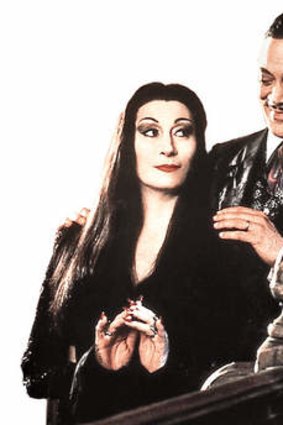 Anjelica Huston as Morticia in The Addams Family movie with  Raul Julia.