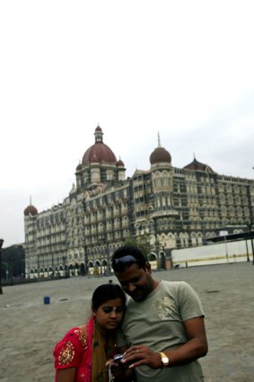 New life ... visitors in front of the Taj Mahal Palace and Tower.