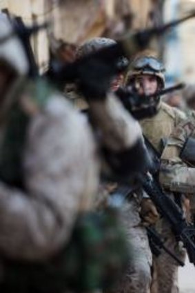 The American Navy SEAL snipers, including Bradley Cooper second from right, are there  to protect troops in Iraq.