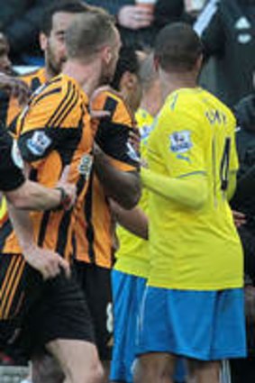 Alan Pardew gestures towards Hull City players before being sent to the stands by the referee.