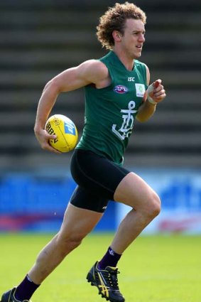 On the run: Chris Mayne training in Perth this week.