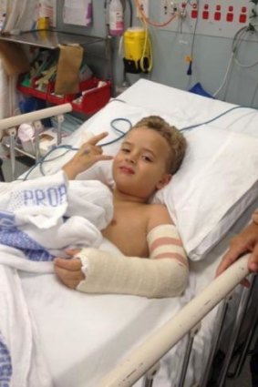 On the mend: Harry Bailey, now 8, was trampolining at a birthday party when he broke his arm.