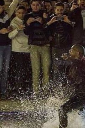 Making a splash: Kanye West takes a dive in Swan Lake during a free show in Armenia. 