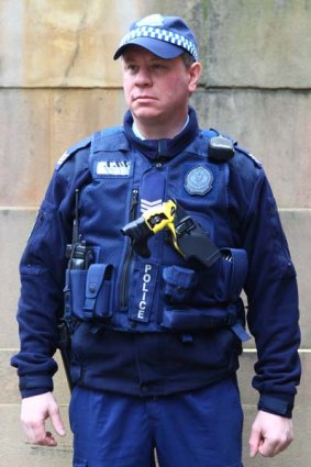 Sergeant Duncan Gray wearing the new load-bearing police vest.