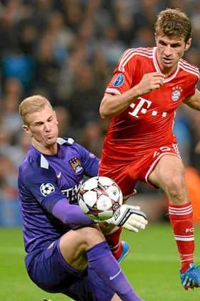 Beaten: Manchester City goalkeeper Joe Hart is rounded by Thomas Muller.