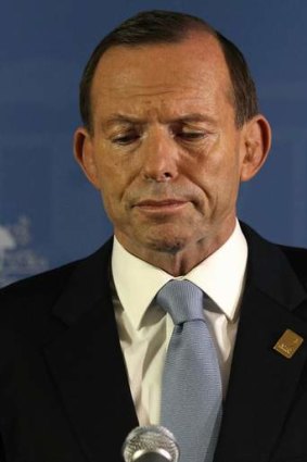 Prime Minister Tony Abbott defends his expenses claims to the media during a press conference in Bali.