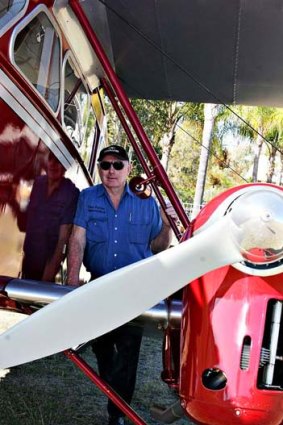 Des Porter with his Dragon. <B><A href= http://www.sunshinecoastdaily.com.au/story/2012/10/01/plane-missing-thick-cloud/ > Vicki Wood, The Sunshine Coast Daily </a></b>