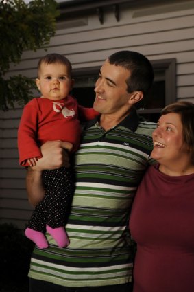 Tim and Liz Spelman, at home in Yarraville  with daughter Lucy,  fall between many of the budget's target groups.