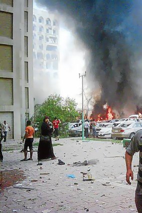 A fire rages in front of the Iraqi foreign ministry building following a massive car bomb explosion.