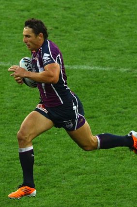 Billy Slater of the Storm runs in to score.