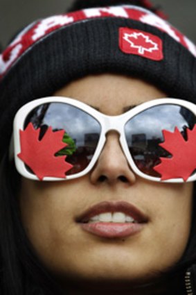 A Canadian fan watches the ice hockey gold medal match.