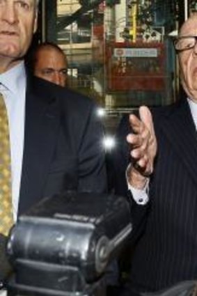 The real deal: Rupert Murdoch attempts to speak at a news conference during the controversial phone-hacking scandal.