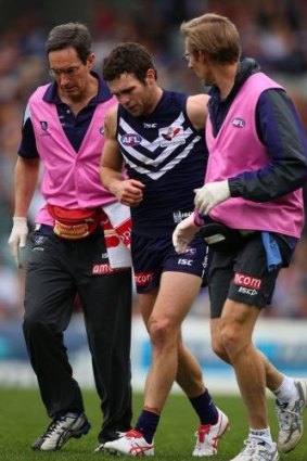 Hayden Ballantyne is assisted from the field after injuring himself during the round 12 match against Adelaide.