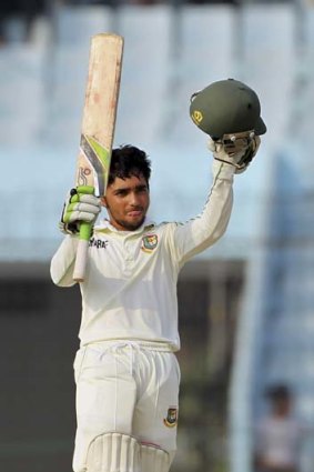 Bangladesh?s Mominul Haque acknowledges the applause after reaching his century on the fifth day of the second Test against Sri Lanka.