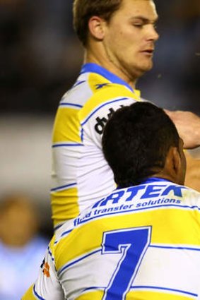 Determination: Paul Gallen of the Sharks runs the ball up against the Eels on Saturday night.
