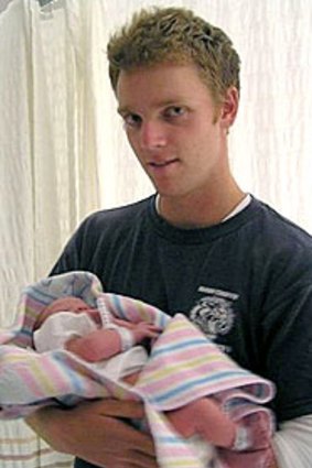 Mathew Hopkins with his newborn son Alex.