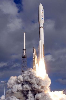 An Atlas 5 rocket lifts off from the launch pad in Cape Canaveral with its payload of the $2.5 billion nuclear-powered NASA Curiosity rover.