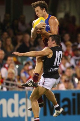 Mitch Clark flies over Steven Baker.