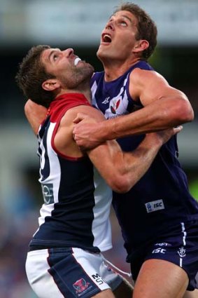 Looking up: Melbourne's Mark Jamar (left) battles with Dockers giant Aaron Sandilands last night.