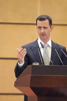 Still in charge ... Bashar al-Assad.
