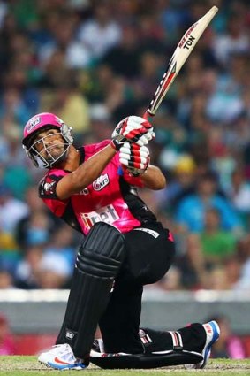 Six sells: Ravi Bopara clears the rope at the SCG on Saturday.