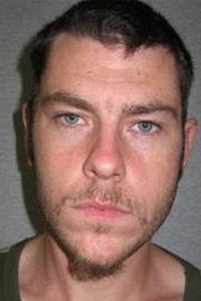 A man wanted for questioning over a double stabbing on the Gold Coast.