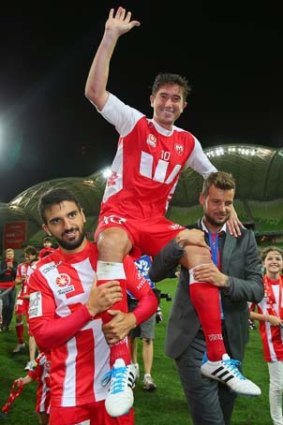 Harry Kewell is chaired off the field after his final match on Saturday.