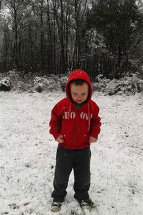 Three-year-old Atticus Spooner of Woodend enjoys the snow at Mt Macedon.